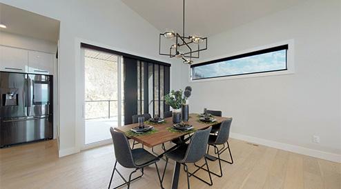 Dining room in a home by Carrington Homes in Lone Pine Estates in Kelowna, British Columbia. 